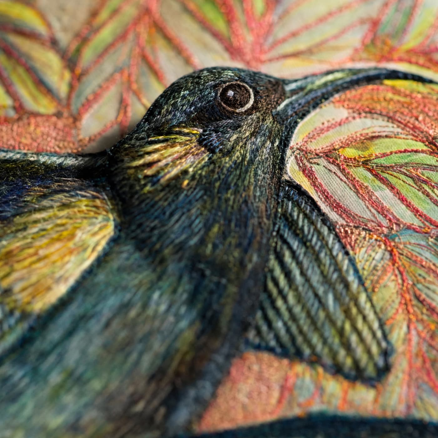 Detailed embroidery of a huia bird.