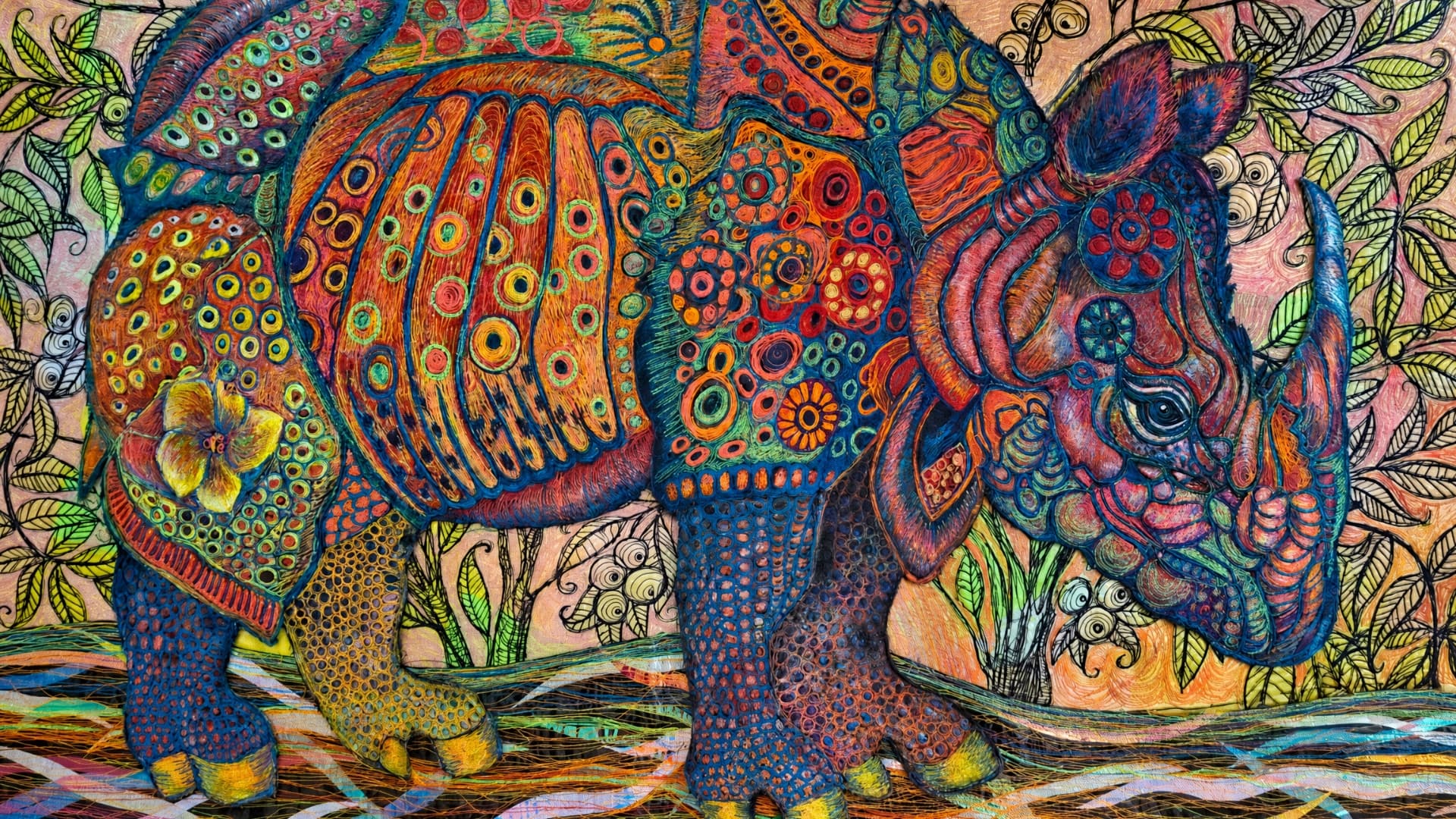 Vibrantly decorated textile art rhinoceros in nature