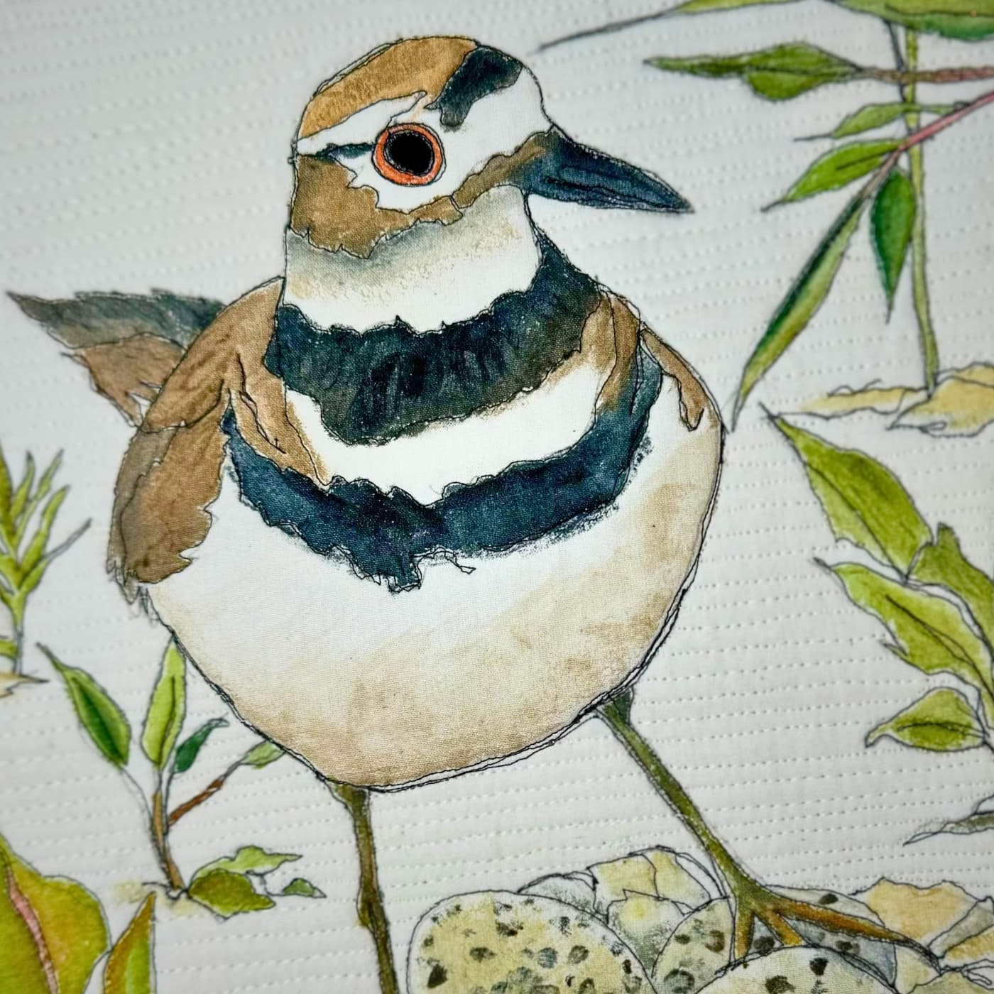 A mixed media artwork of a bird 