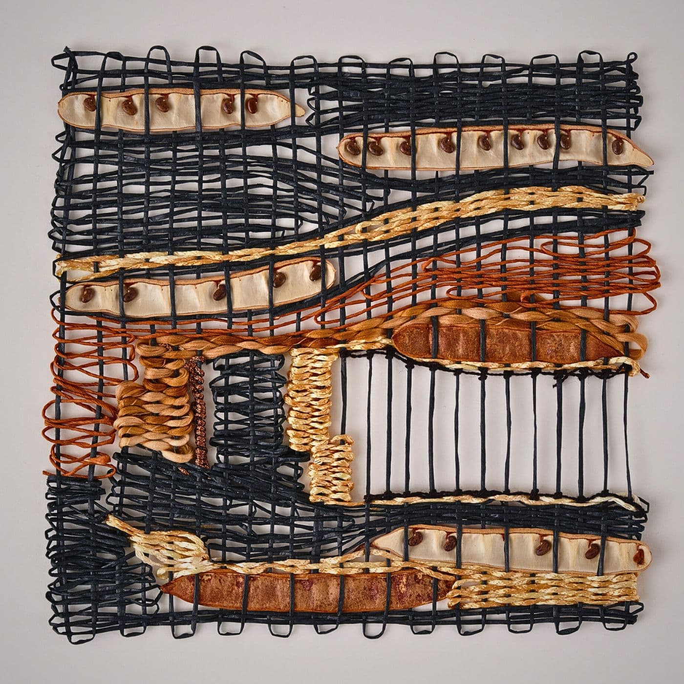 Intricate woven artwork made with natural materials.