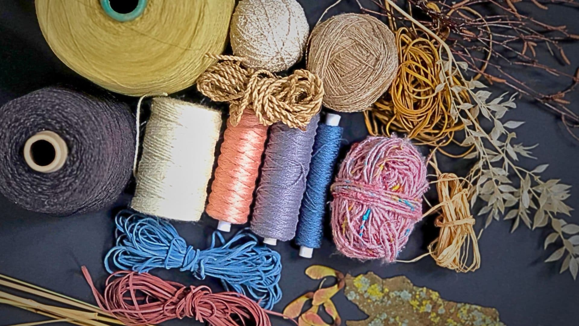 A moodboard with yarns and materials.