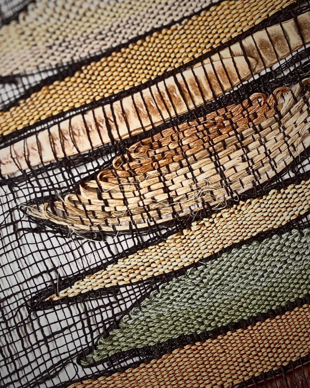 Intricate textile design of seed pods.