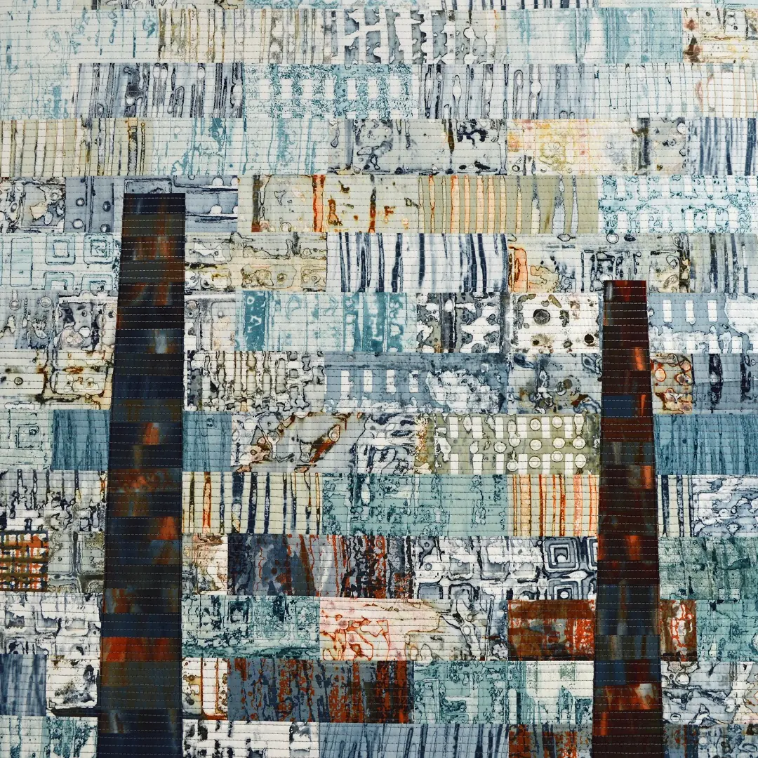 Leah Higgins, Ruins 9: Cottonopolis Revisited (detail), 2018. 256cm x 132cm (8’ x 4’). Screen printing, dyeing, collage and piecing, machine quilting. Artist’s own printed and dyed cotton fabrics, acrylic felt wadding, hand-dyed cotton backing and Madeira Cotona threads.