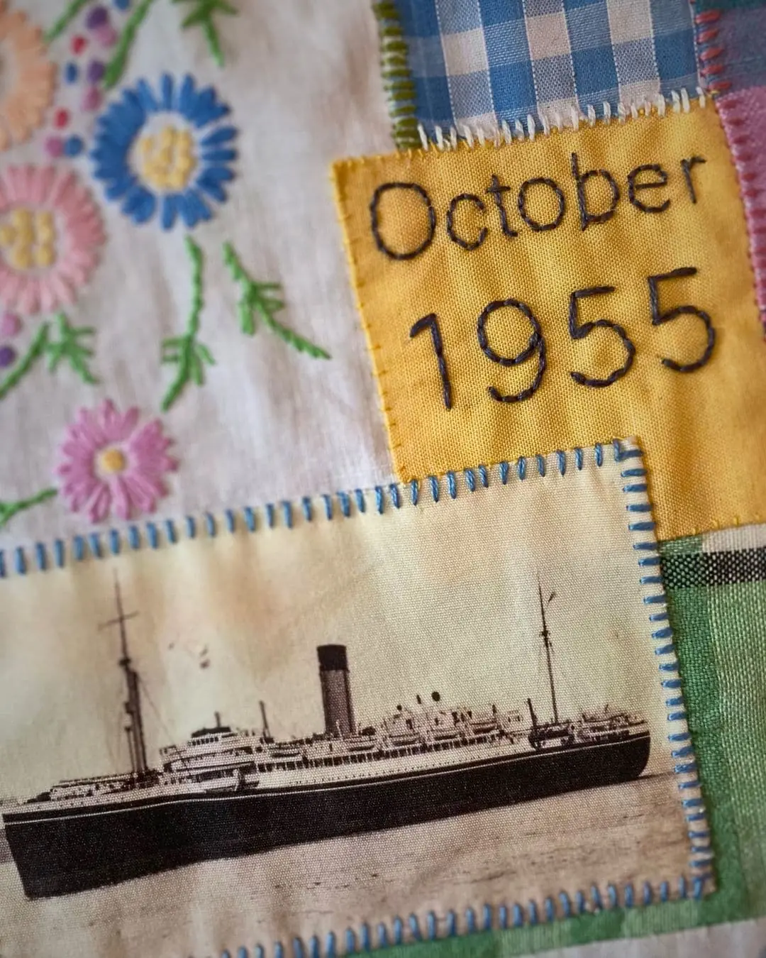 a patchwork quilt with a picture of a ship