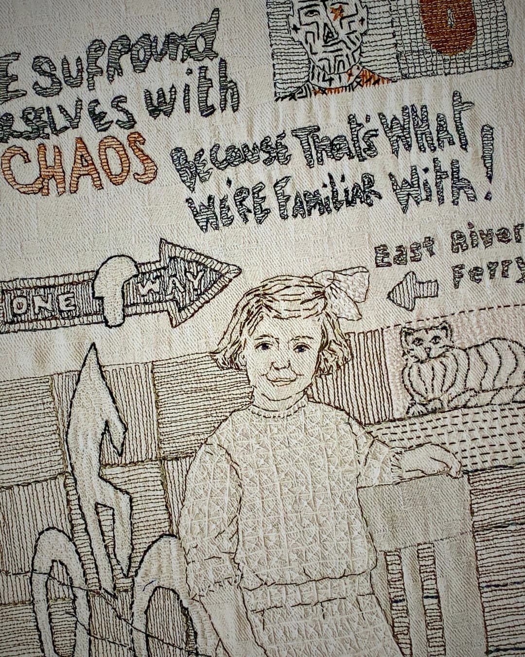 Embroidered artwork depicting a girl with Brooklyn symbols behind her