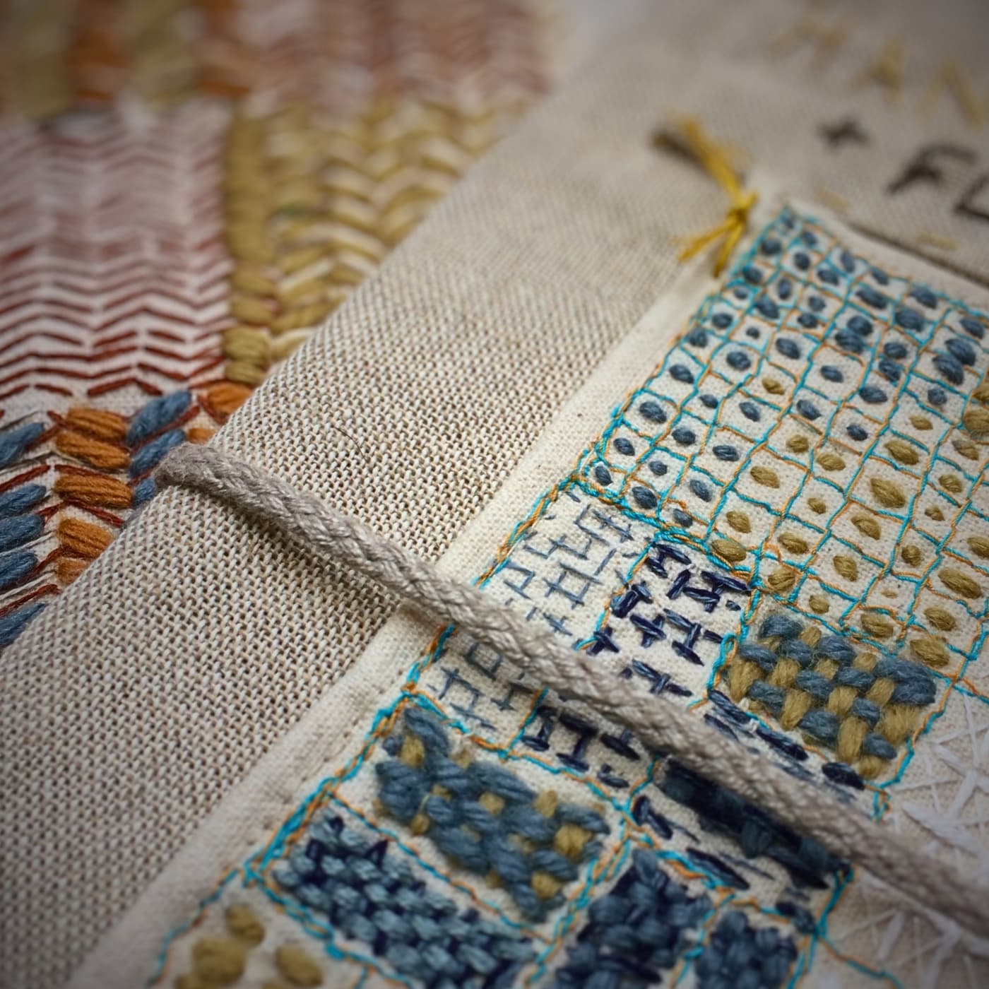 Intricate embroidery on textured fabric.