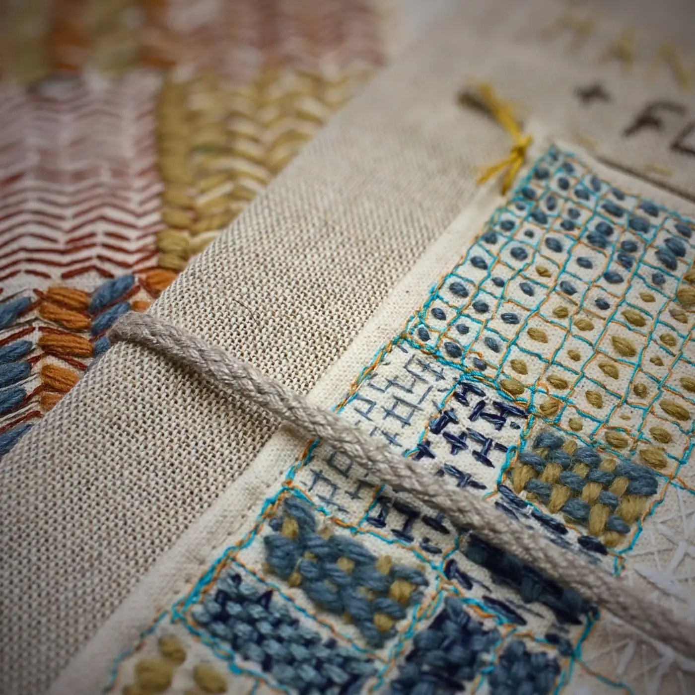 Intricate embroidery on textured fabric.