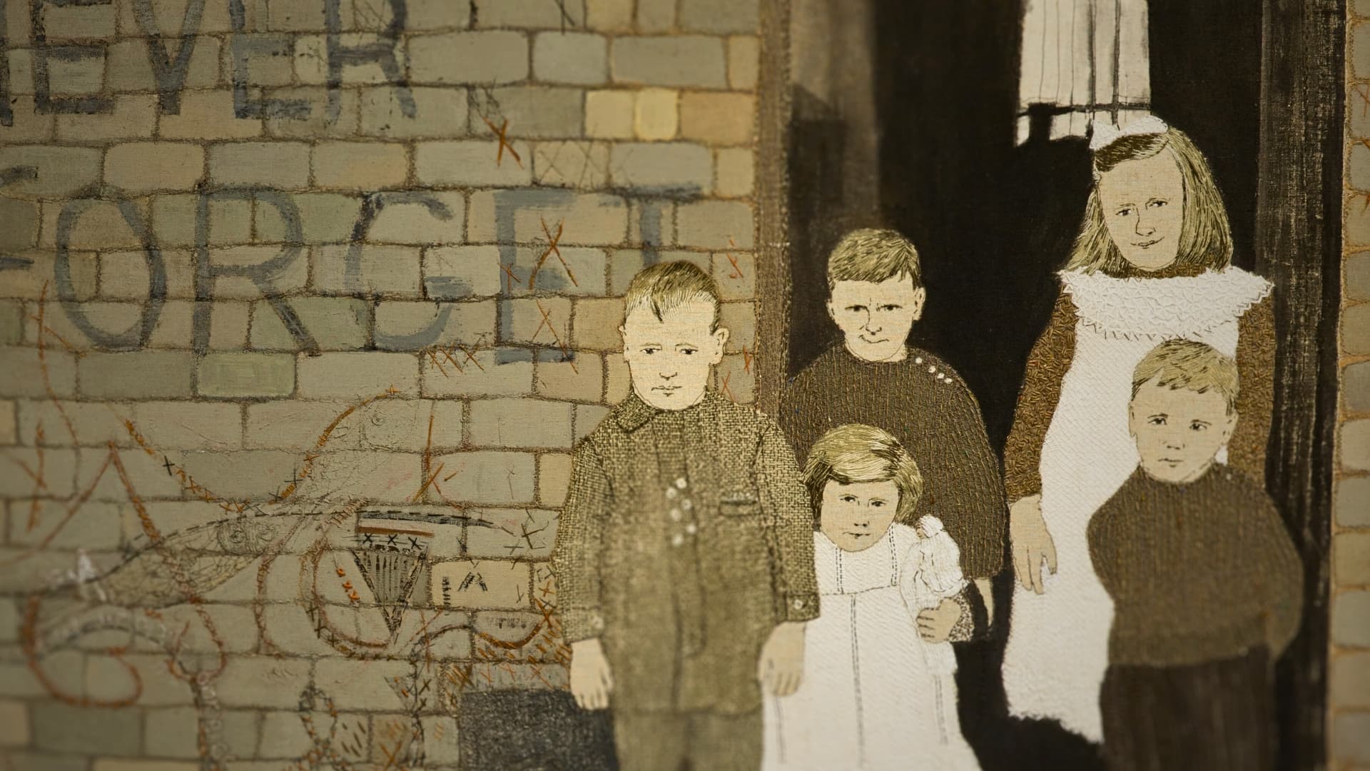 Textile arti piece depicting children standing by a graffitied brick wall.