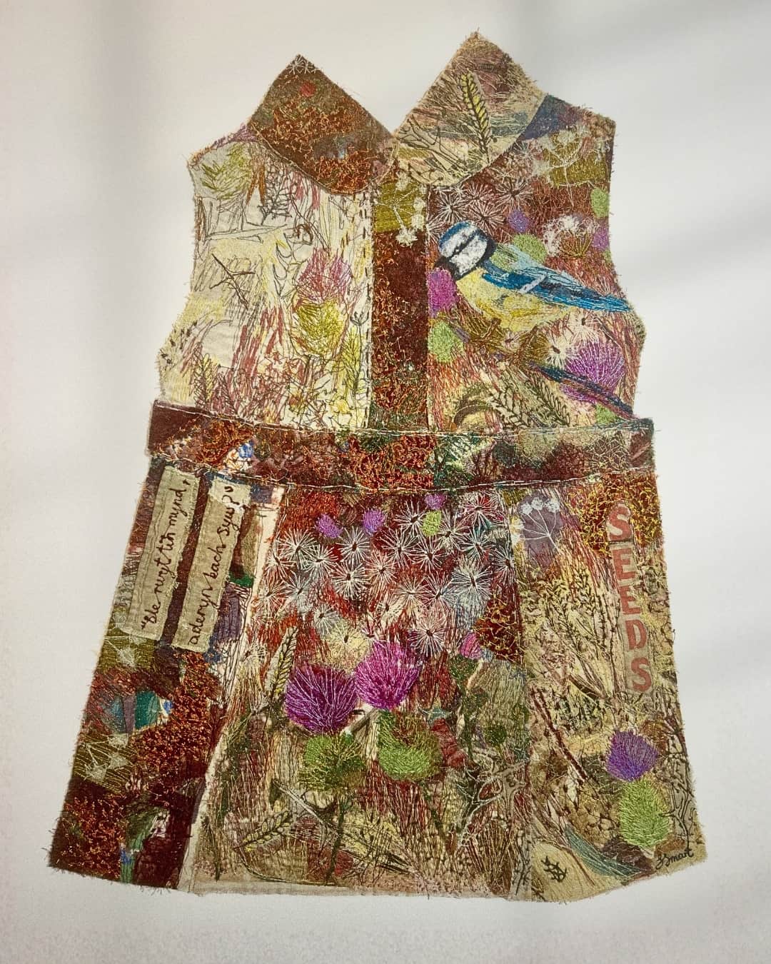 Colourful embroidered dress with nature theme
