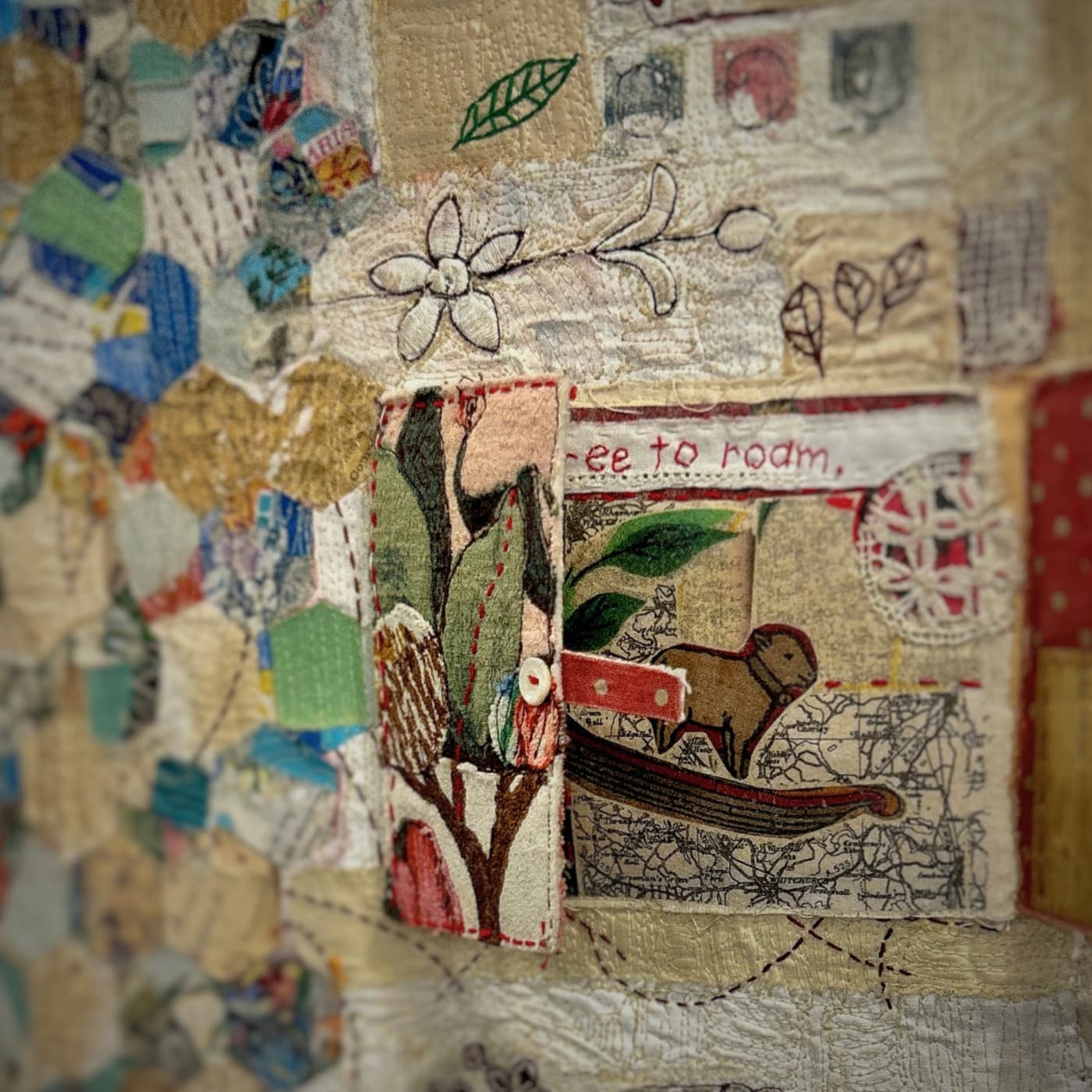 Textured fabric collage with stitched elements