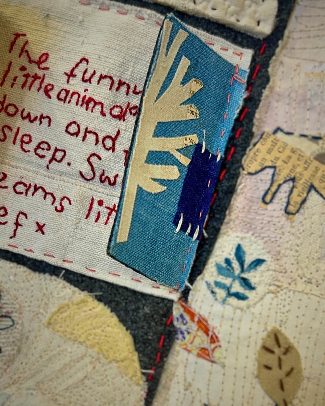 Colourful fabric collage with textile embellishments