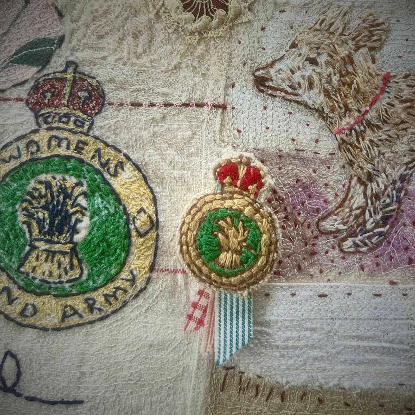 Embroidered badge and decorative stitching.