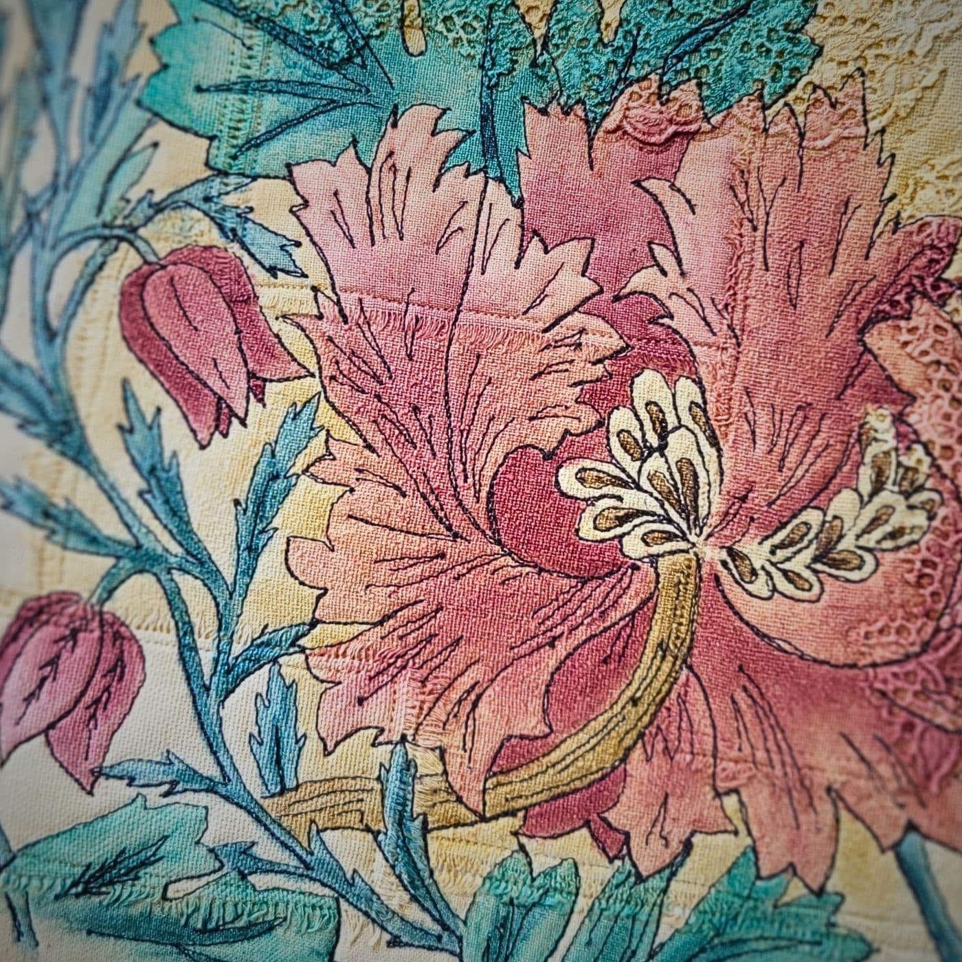 A fabric painting of flowers