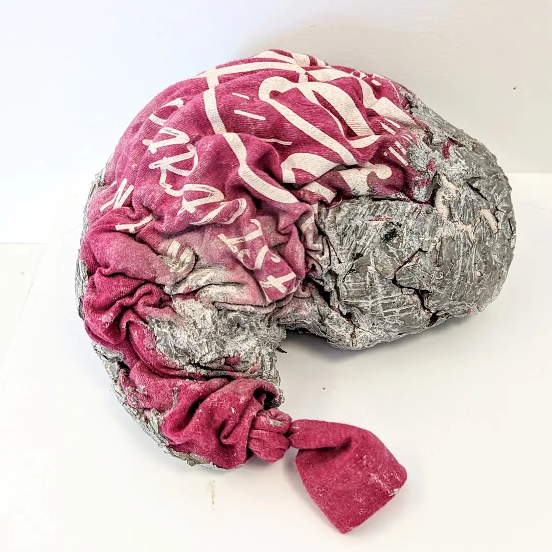 Lump of concrete with a T-shirt amongst it
